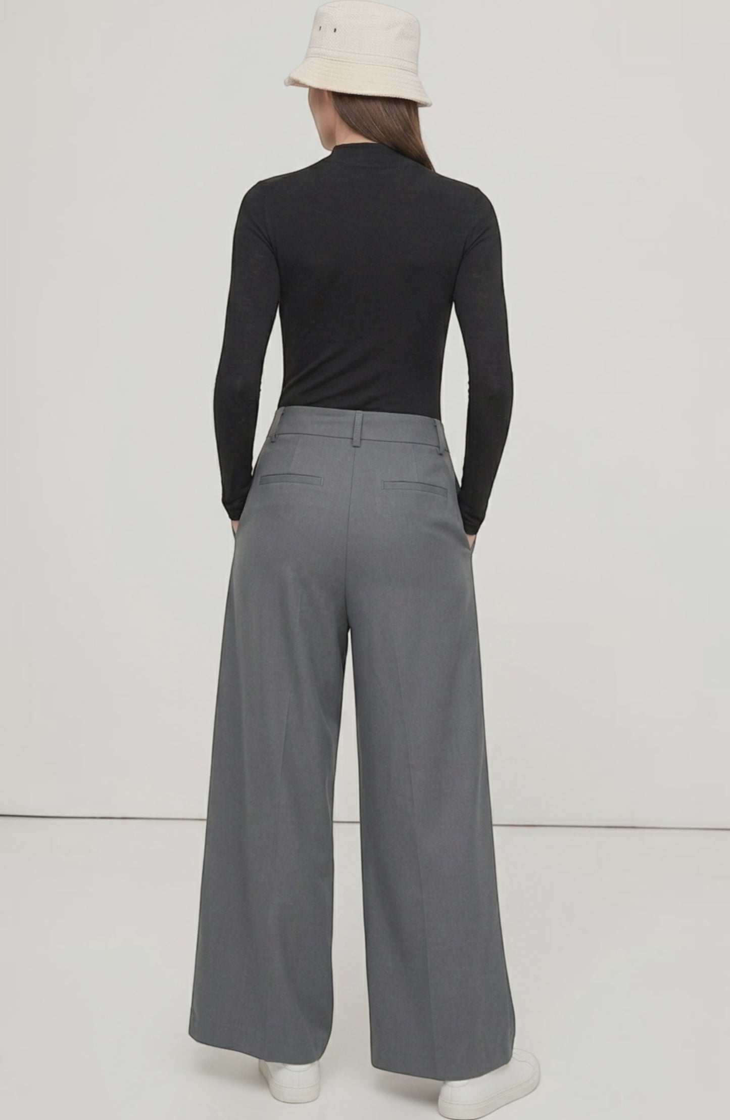 LORVENE Curve Form Pants modeled in a top-right pose, showcasing their sleek fit and modern design.