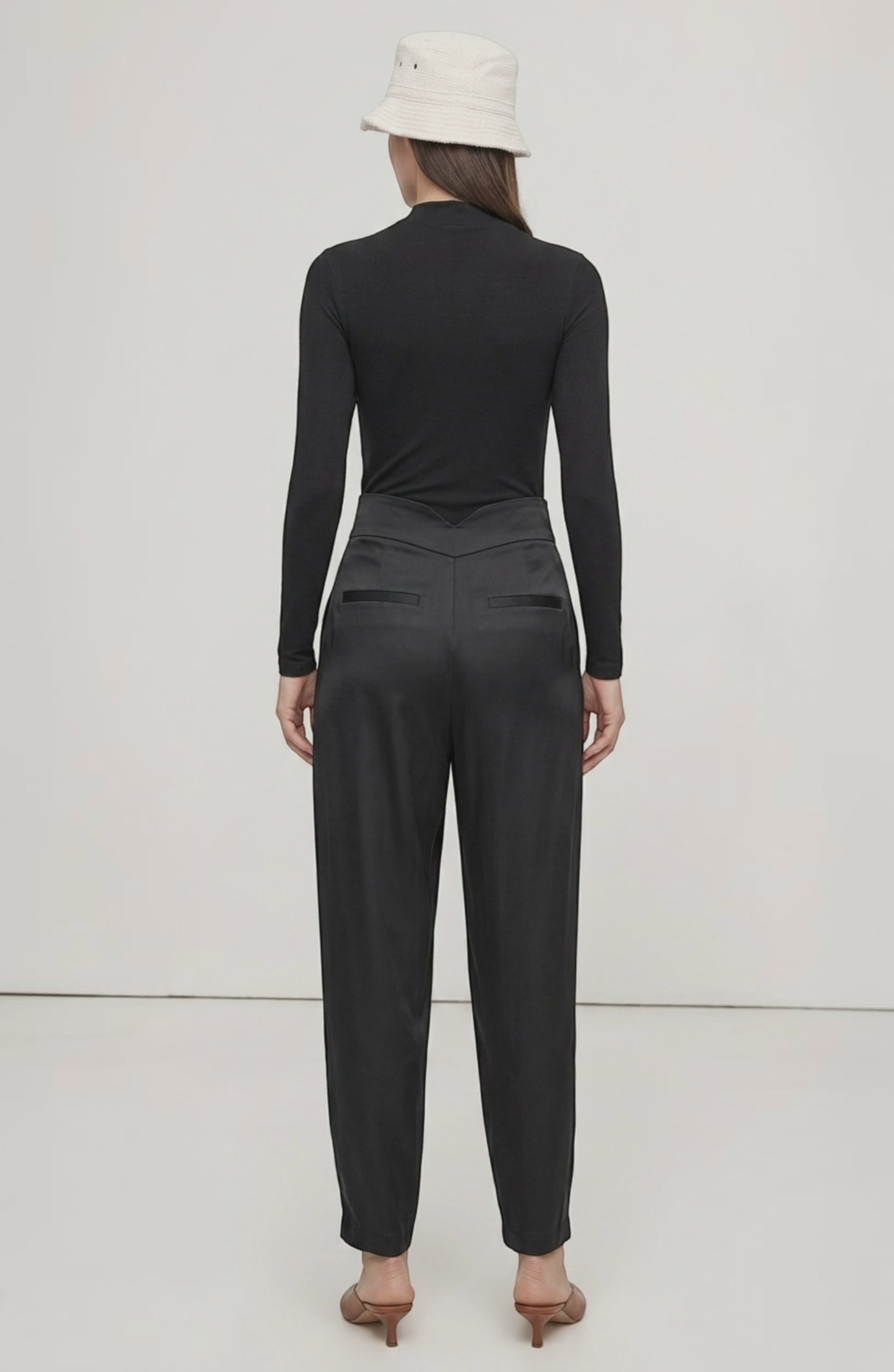 LORVENE Line Edge Pants shown from a top right angle, featuring sleek design and tailored fit in a neutral color.