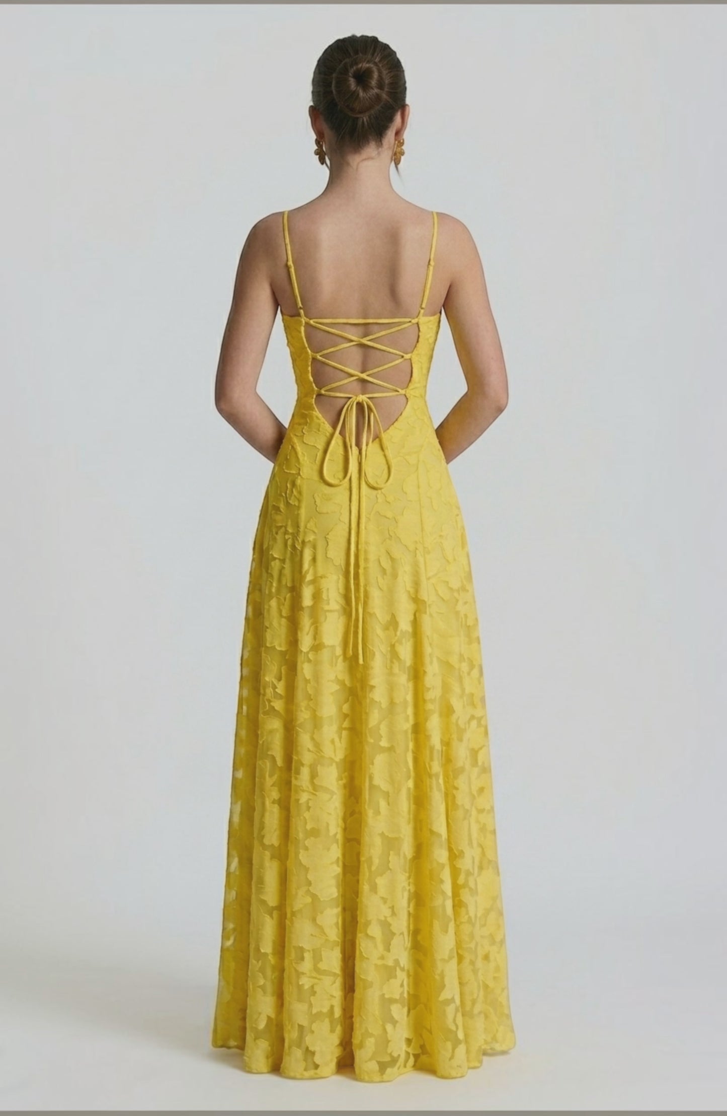 Back view of LORVENES sexy flowy bridal dress with a flowing silhouette and elegant design, perfect for a wedding or special occasion.