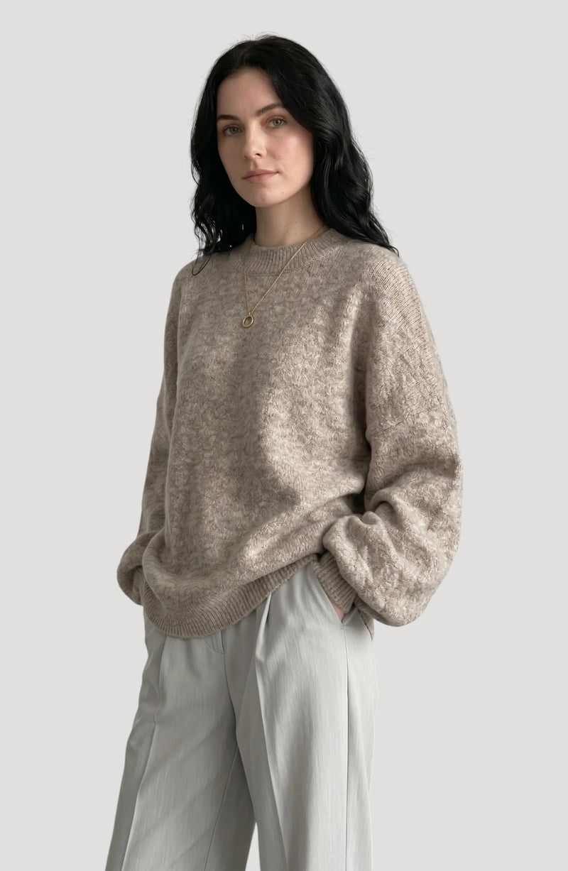 LORVENE cropped rib pullover displayed in a relaxed pose, showcasing the fitted knit and cropped design in a neutral setting.