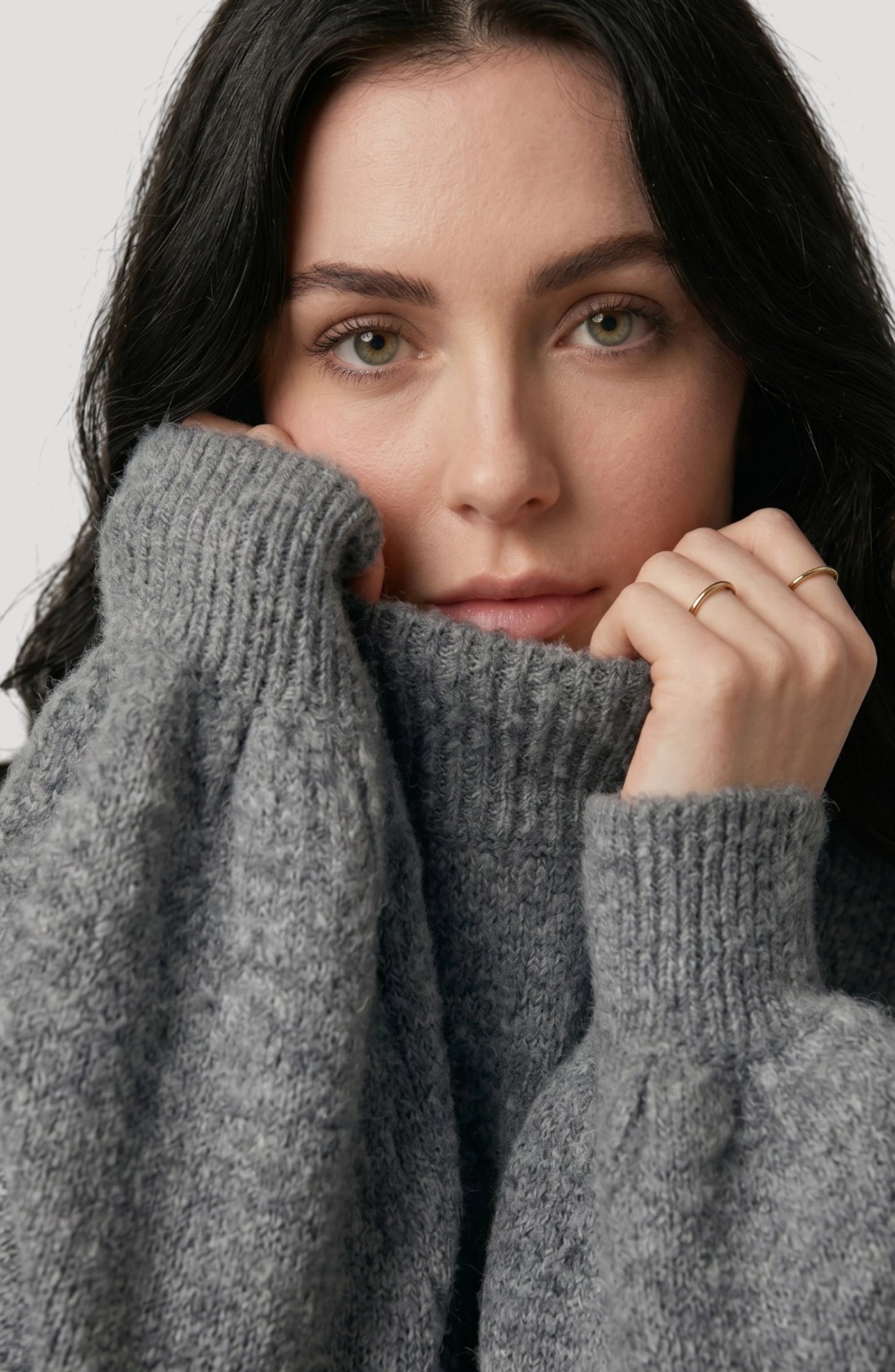 LORVENE cropped rib pullover shown from the bottom right pose, featuring a fitted knit design and ribbed hem.