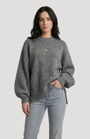 LORVENE cropped rib pullover displayed in a front view, featuring a fitted design with ribbed knit fabric and long sleeves.
