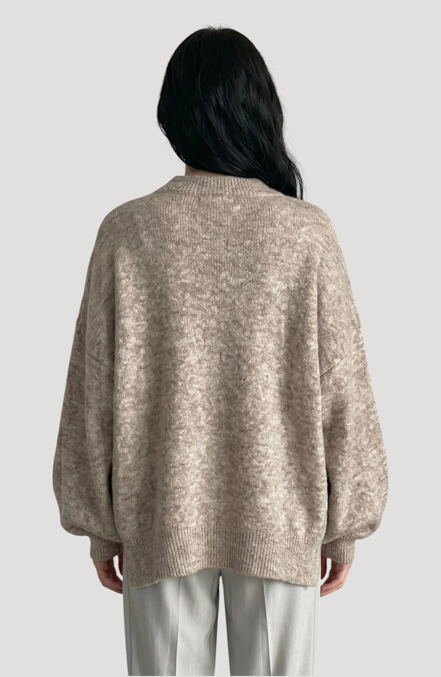 LORVENE cropped rib pullover displayed in a top-right pose, showcasing the textured knit fabric and stylish fit.