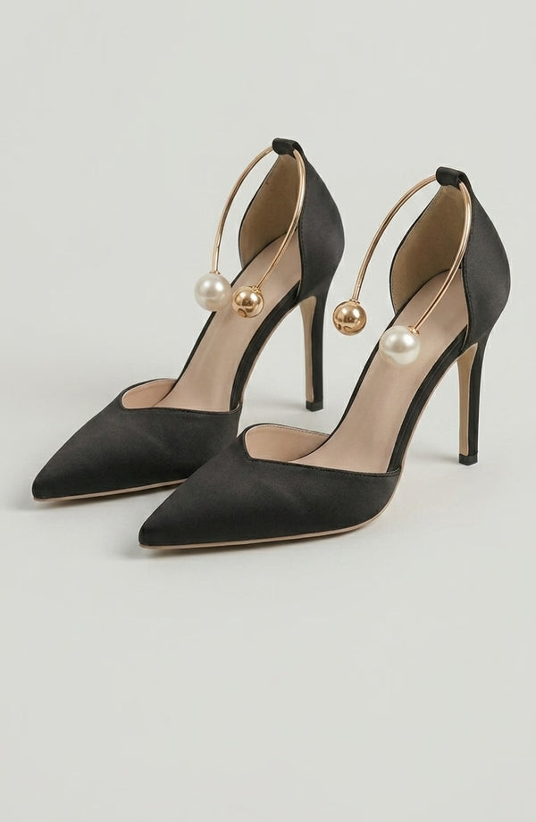LORVENE Icon Charm Heels featuring stylish design with a pointed toe and decorative charm accents on a sleek high-heeled shoe (600x920) (600x920)
