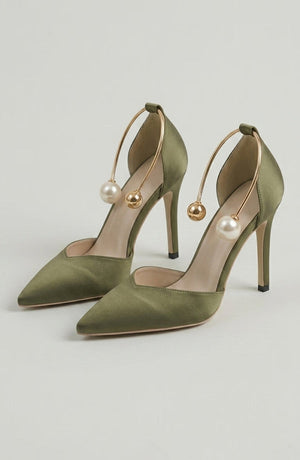 LORVENE Icon Charm Heels with stylish design and pointed toe, featuring decorative icons on the black high-heeled shoes. (600x920)