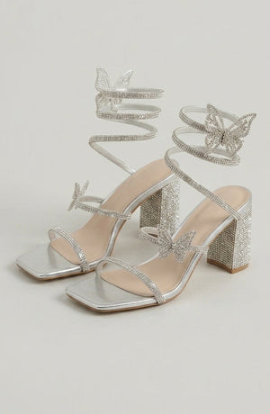 Silver rhinestone sandals by LORVENES featuring sparkling embellishments and open-toe design for stylish summer footwear. (600x920)