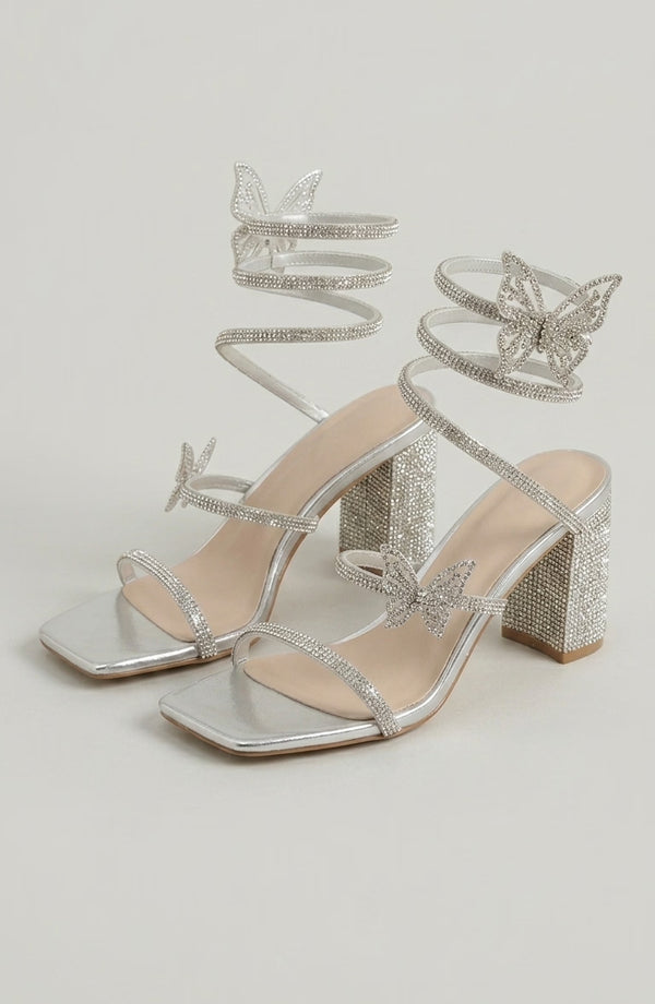 Silver rhinestone sandals by LORVENES featuring sparkling embellishments and open-toe design for stylish summer footwear. (600x920)