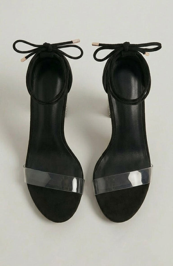 LORVENE Nova Elegance heels with pointed toes and slim stiletto heels, in classic black leather, displayed on a white background. (600x920)