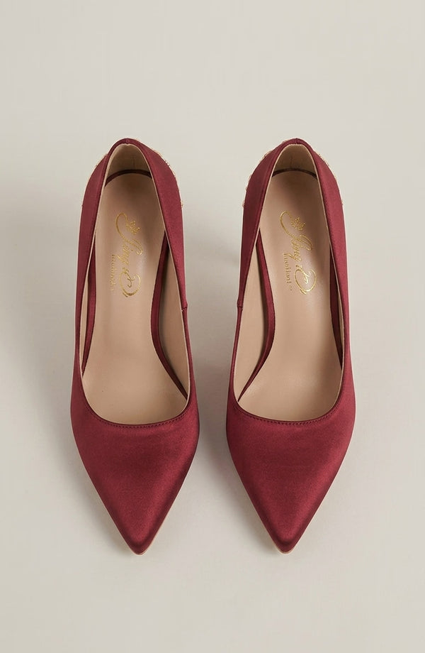 LORVENES Opal Muse heels featuring sleek design and elegant style, with a close-up of the black high-heeled shoes. (600x920)