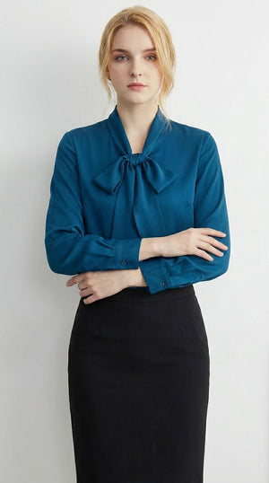 LORVENE double pocket shirt with button-down front, shown hanging on a wooden hanger, featuring a classic collar and long sleeves.