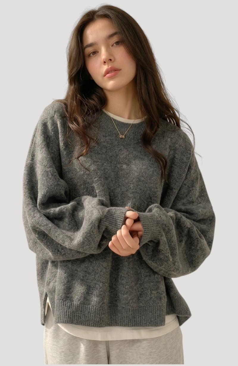 LORVENES Everyday Oversized Sweater in neutral color, featuring a relaxed fit and soft knit fabric, shown from the bottom left angle.