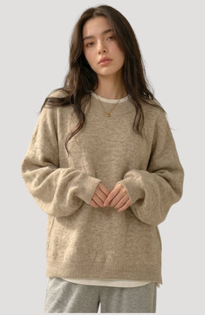 LORVENES Everyday oversized sweater in neutral color, featuring a relaxed fit and soft knit fabric, shown from bottom left angle.