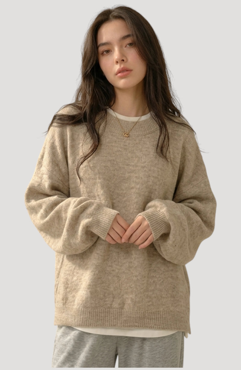 LORVENES Everyday oversized sweater in neutral color, featuring a relaxed fit and soft knit fabric, shown from bottom left angle.