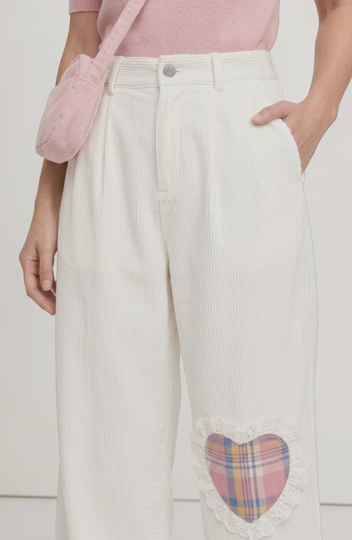 LORVENE Sleek Ease Pants in black, shown from bottom left pose, featuring a slim fit and modern design.