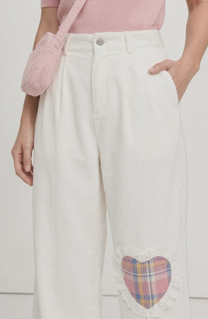 LORVENE Sleek Ease Pants in black, shown from bottom left pose, featuring a slim fit and modern design.