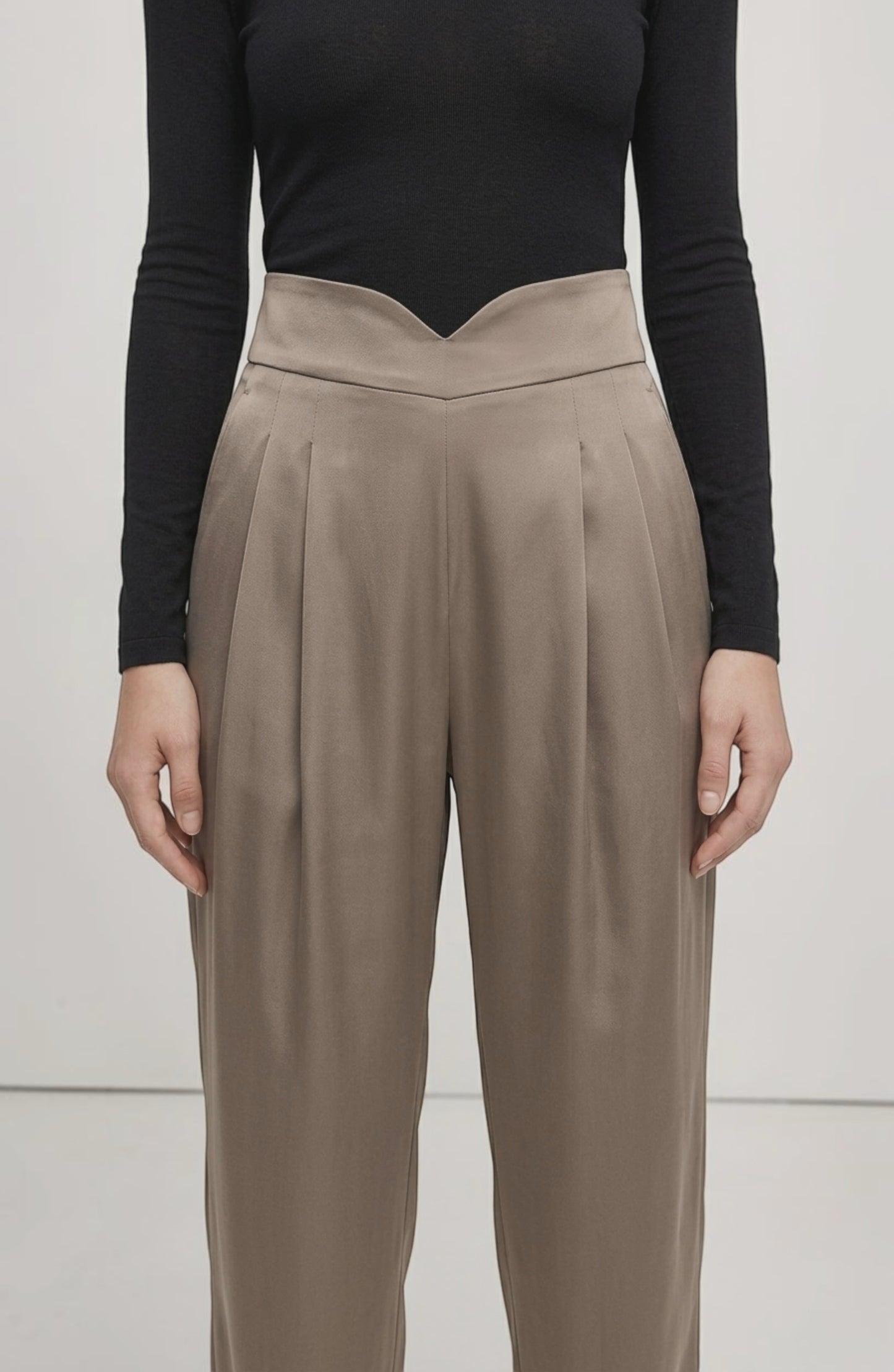 LORVENE Line Edge Pants displayed from a bottom left pose, showcasing the stylish design and fit of the pants.