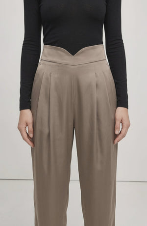 LORVENE Line Edge Pants displayed from a bottom left pose, showcasing the stylish design and fit of the pants.