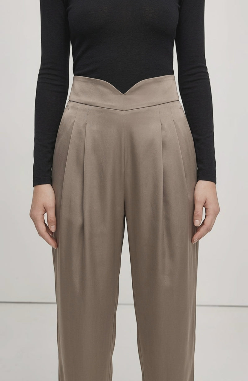LORVENE Line Edge Pants displayed from a bottom left pose, showcasing the stylish design and fit of the pants.