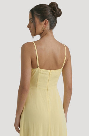 LORVENE Pure Ruffle Maxi dress with flowing fabric and ruffle details, shown from the bottom right angle.