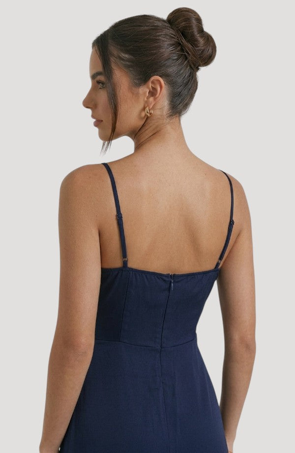 LORVENE Pure Ruffle Maxi dress shown from the bottom right, featuring flowing fabric and ruffle details in a full-length style.