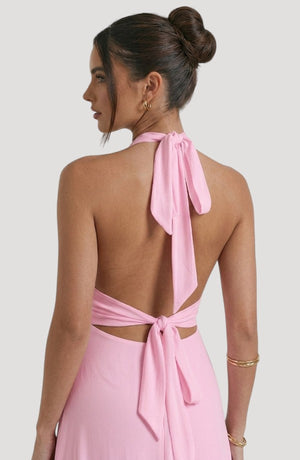 LORVENE Luxe Draped Dress shown from the bottom right, showcasing its elegant fabric and flowing design.