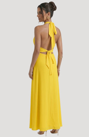 LORVENE Luxe Draped Dress shown from the bottom right, featuring elegant fabric draping and a sophisticated design.