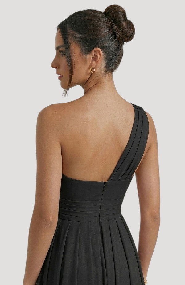 LORVENE crystal wrap dress featuring shimmering fabric and elegant design, showcased on a model against a neutral background.