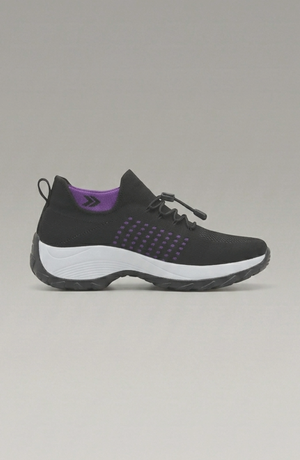LORVENE Calm Glow sneakers featuring a sleek design with white and pastel accents, shown from the bottom left angle.