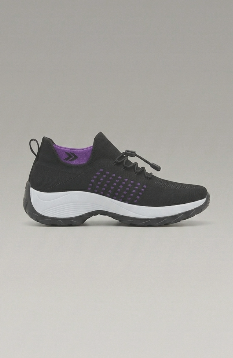 LORVENE Calm Glow sneakers featuring a sleek design with white and pastel accents, shown from the bottom left angle.