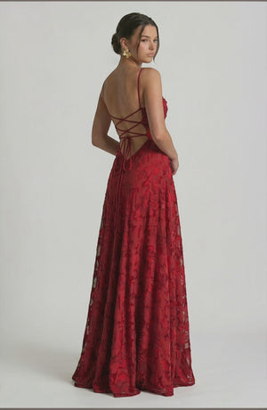 Elegant flowy bridal dress by LORVENES with delicate fabric and intricate design, perfect for wedding ceremonies.