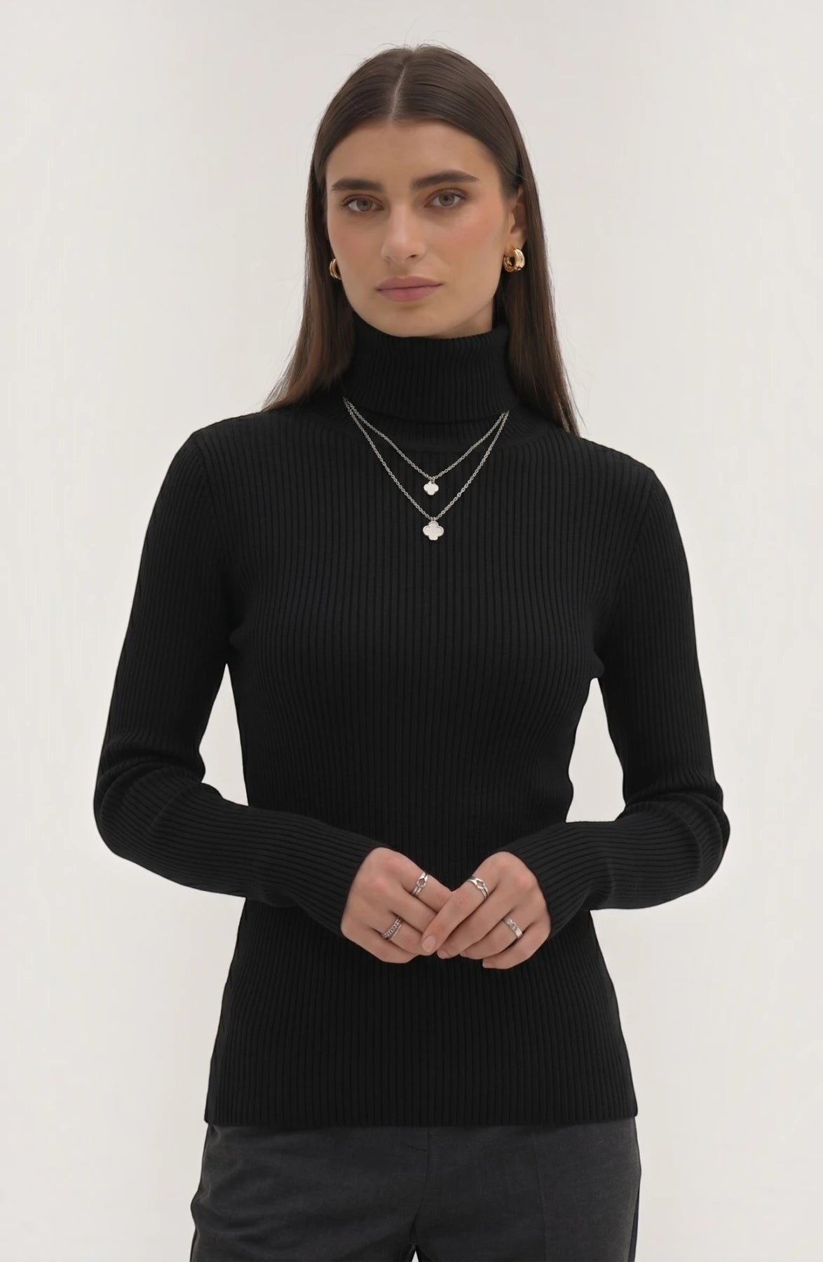 Soft polyester high neck top by LORVENE, featuring a smooth fabric and a classic high neckline, shown in a front view.