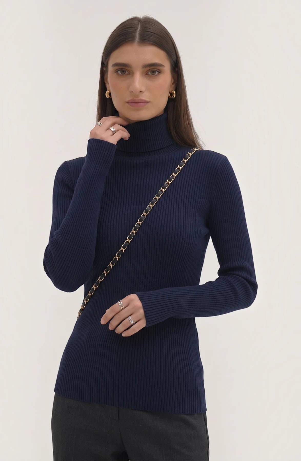 LORVENE pure soft polyester high neck top in black, featuring a close-up of the smooth fabric and high neckline detail.