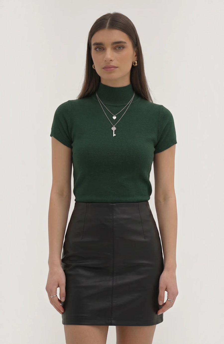 LORVENE Pure Poly Blend High Neck top in black, close-up image showing fabric texture and high neckline design.