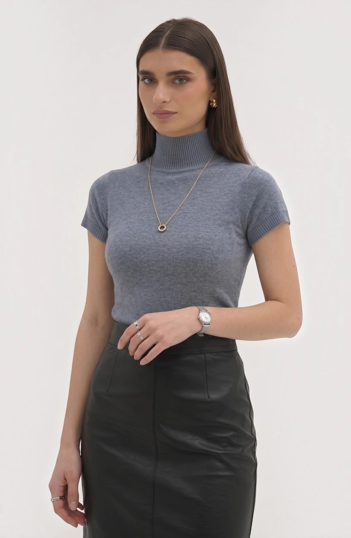 LORVENE Pure Poly Blend High Neck sweater in neutral color, close-up of the soft fabric and high neckline detail.