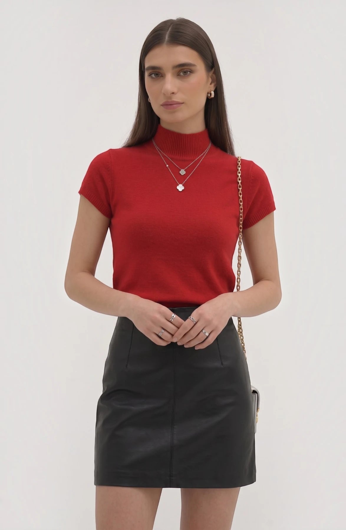LORVENE Pure Poly Blend High Neck top in black, showing close-up of fabric and high neckline detail in a well-lit setting.