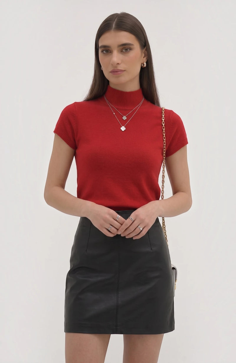 LORVENE Pure Poly Blend High Neck top in black, showing close-up of fabric and high neckline detail in a well-lit setting.