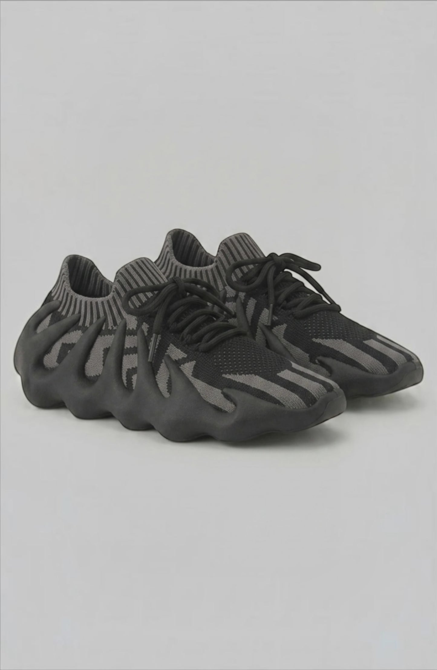 LORVENES Midnight Muse sneakers featuring black and gray color with stylish laces and sleek design.