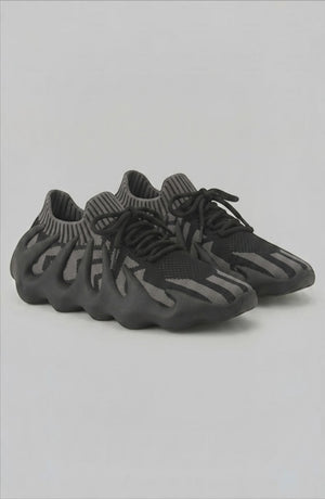 LORVENES Midnight Muse sneakers featuring black and gray color with stylish laces and sleek design.