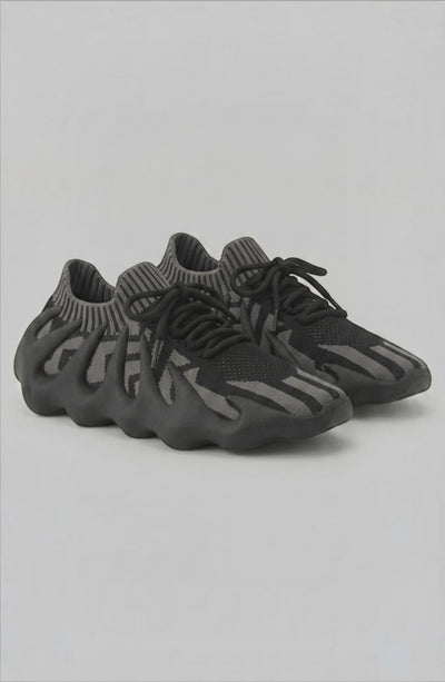LORVENES Midnight Muse sneakers featuring black and gray color with stylish laces and sleek design.