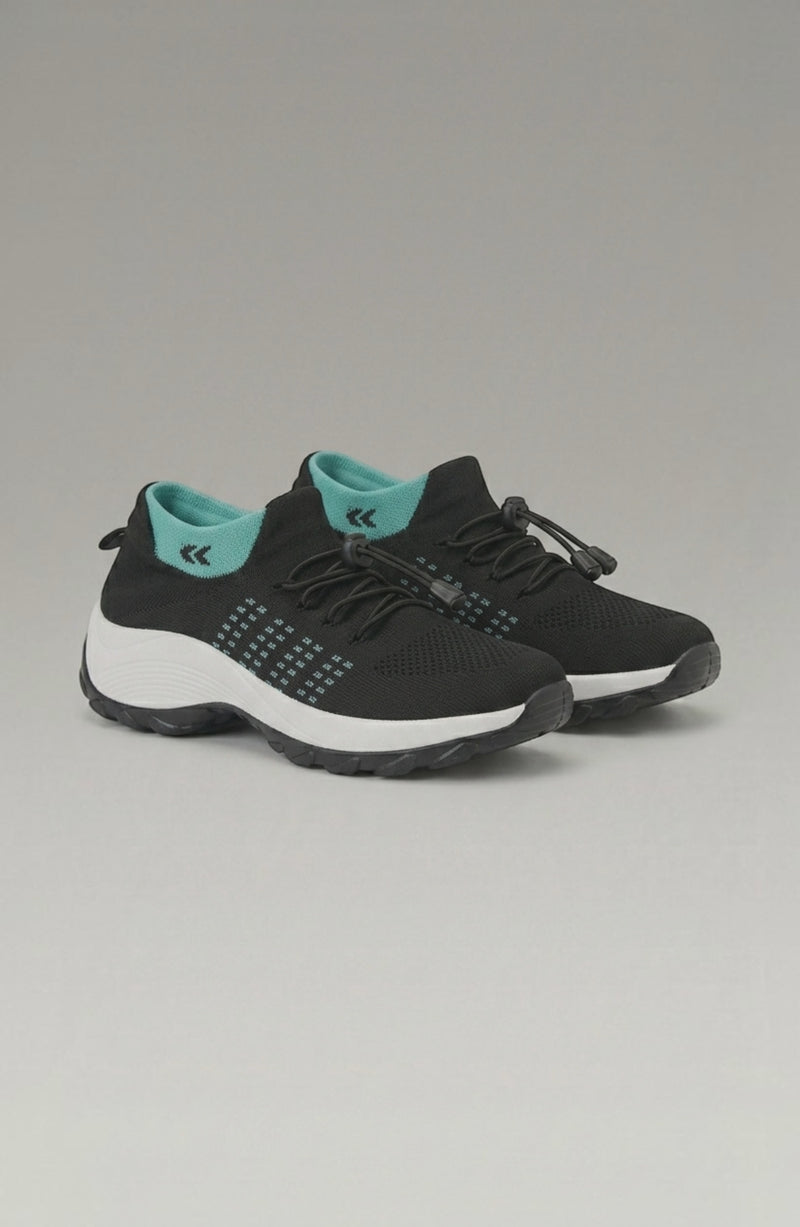 LORVENE Calm Glow sneakers in pastel pink with white soles, showcasing their sleek design and comfortable fit.