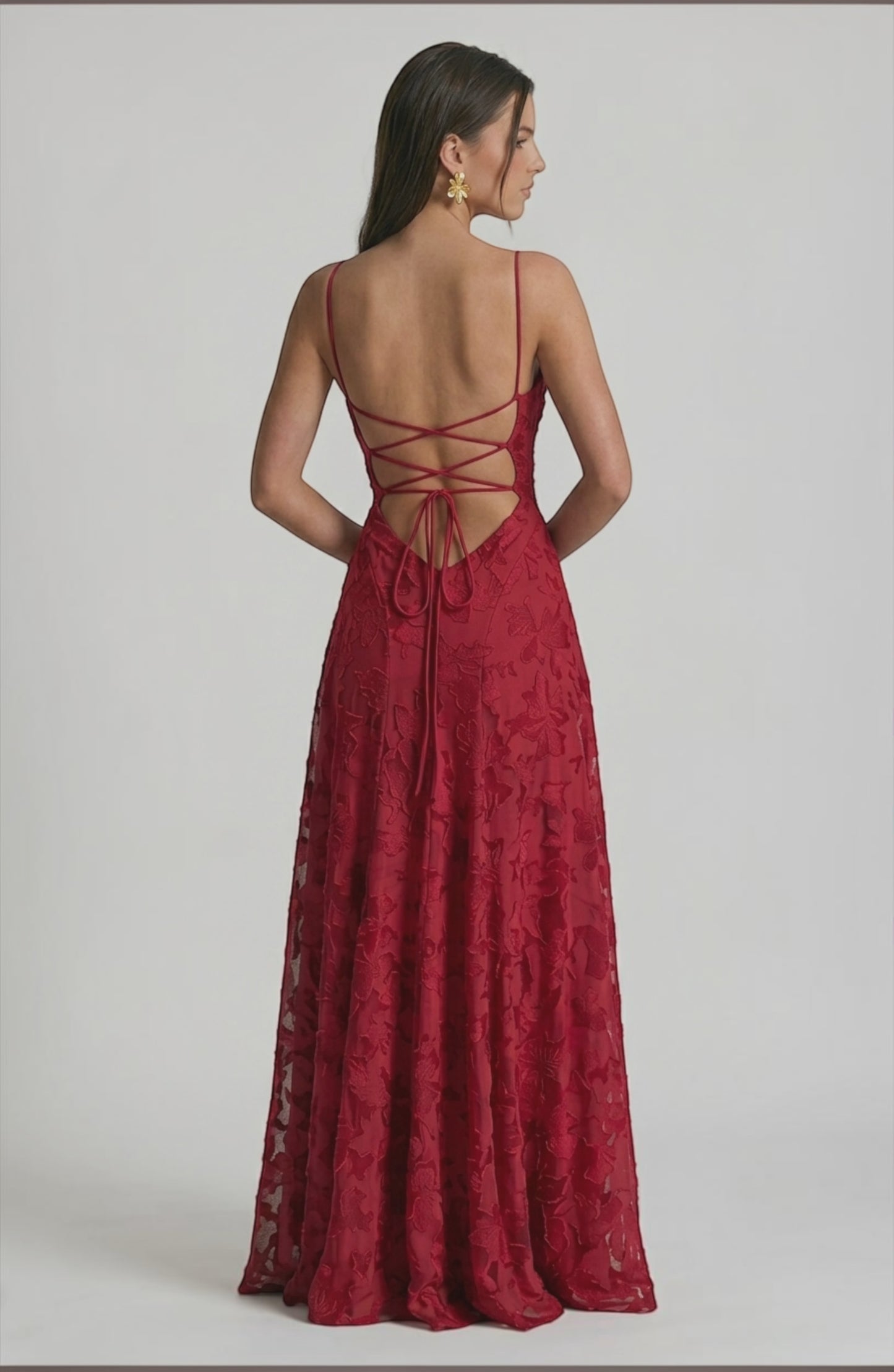 LORVENES sexy flowy bridal dress with elegant fabric and intricate details, displayed in a natural pose on a light background.