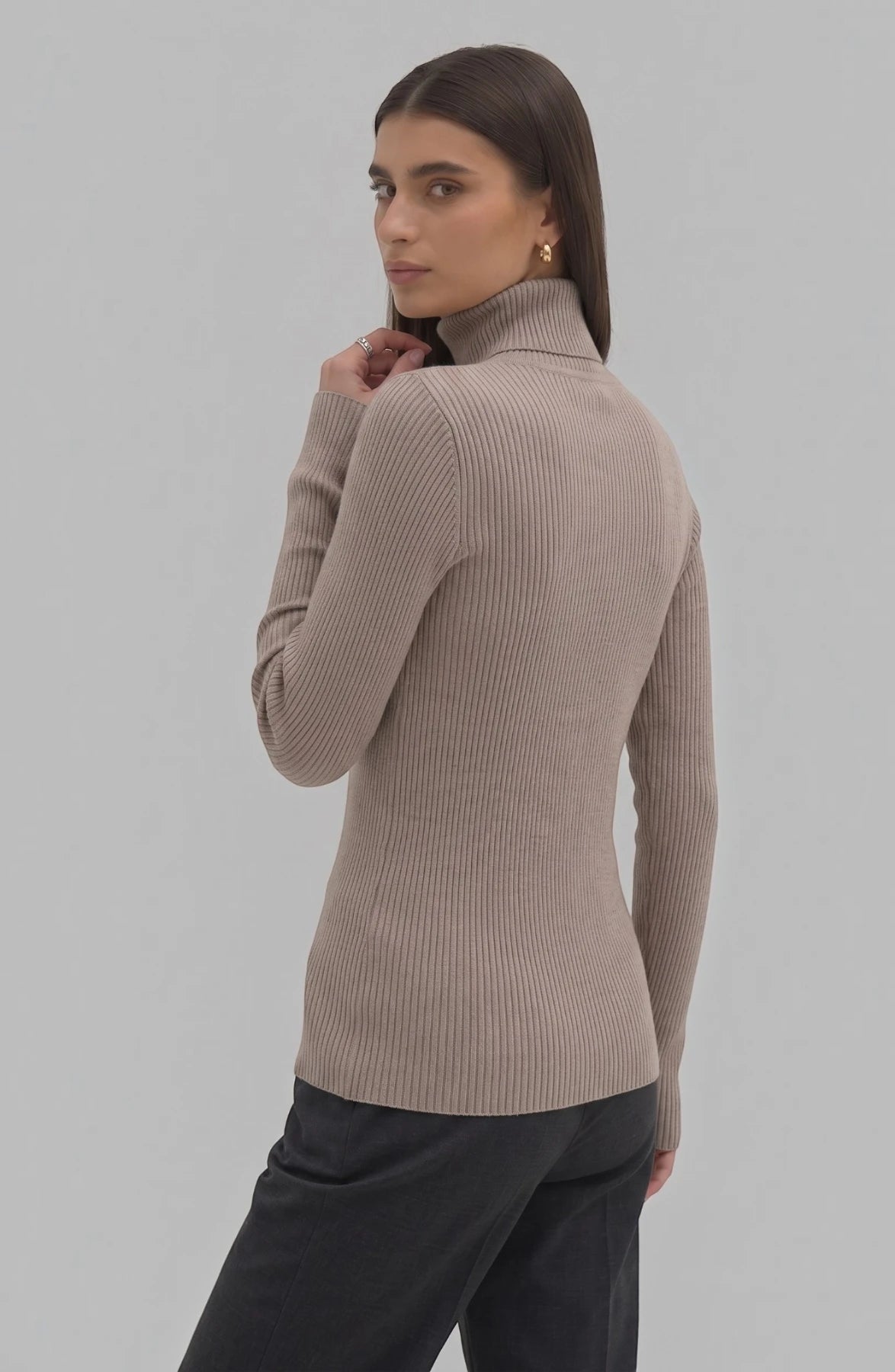 LORVENE Pure Soft Polyester High Neck top in black, featuring a smooth fabric and high neckline, displayed on a hanger.