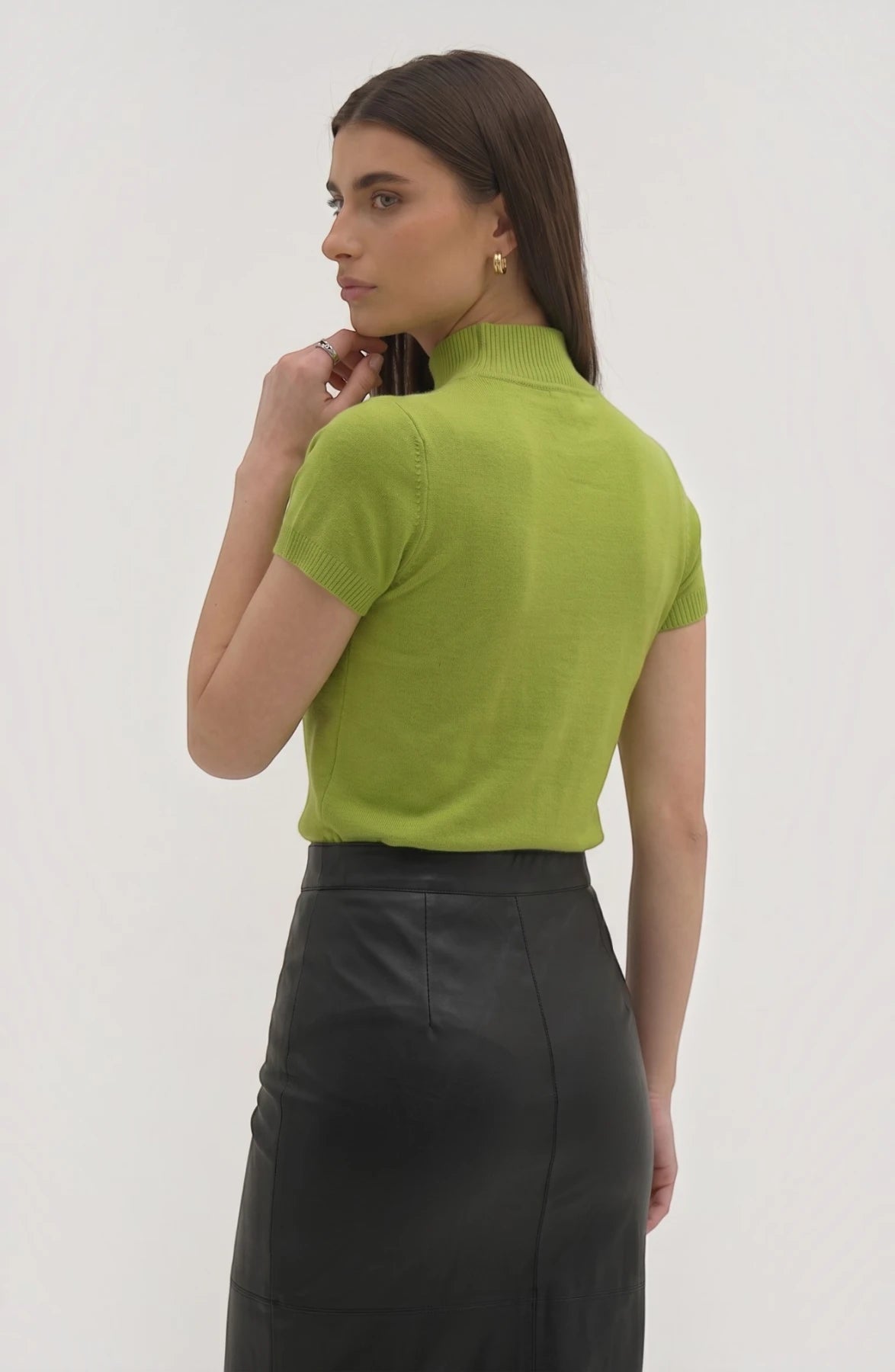 LORVENE Pure Poly Blend High Neck sweater shown in black, featuring a close-up of the high neckline and soft fabric texture.