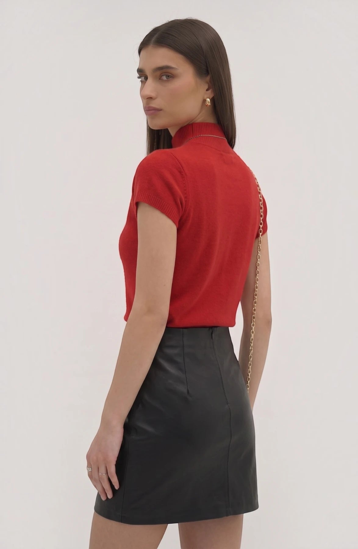 LORVENE Pure Poly Blend High Neck sweater in neutral color, close-up showing fabric texture and high neckline detail.