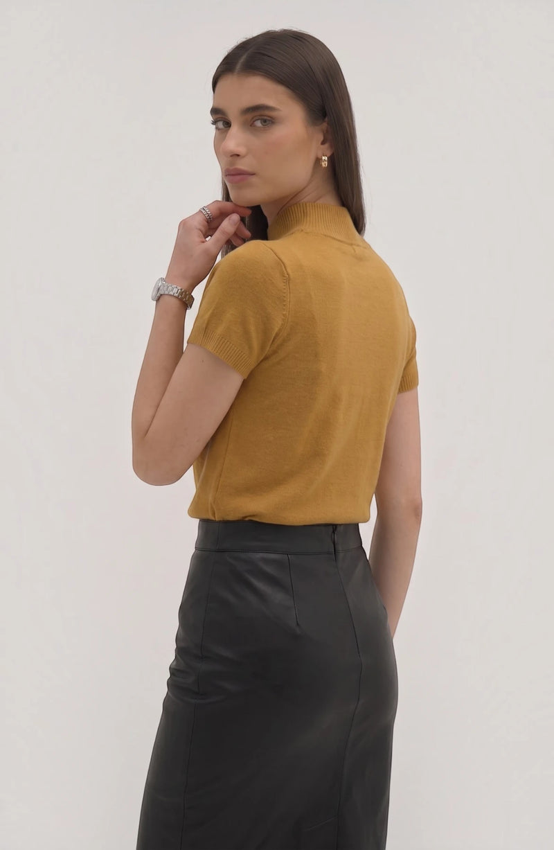 LORVENE Pure Poly Blend High Neck sweater in neutral color, close-up of fabric texture and high neckline design.