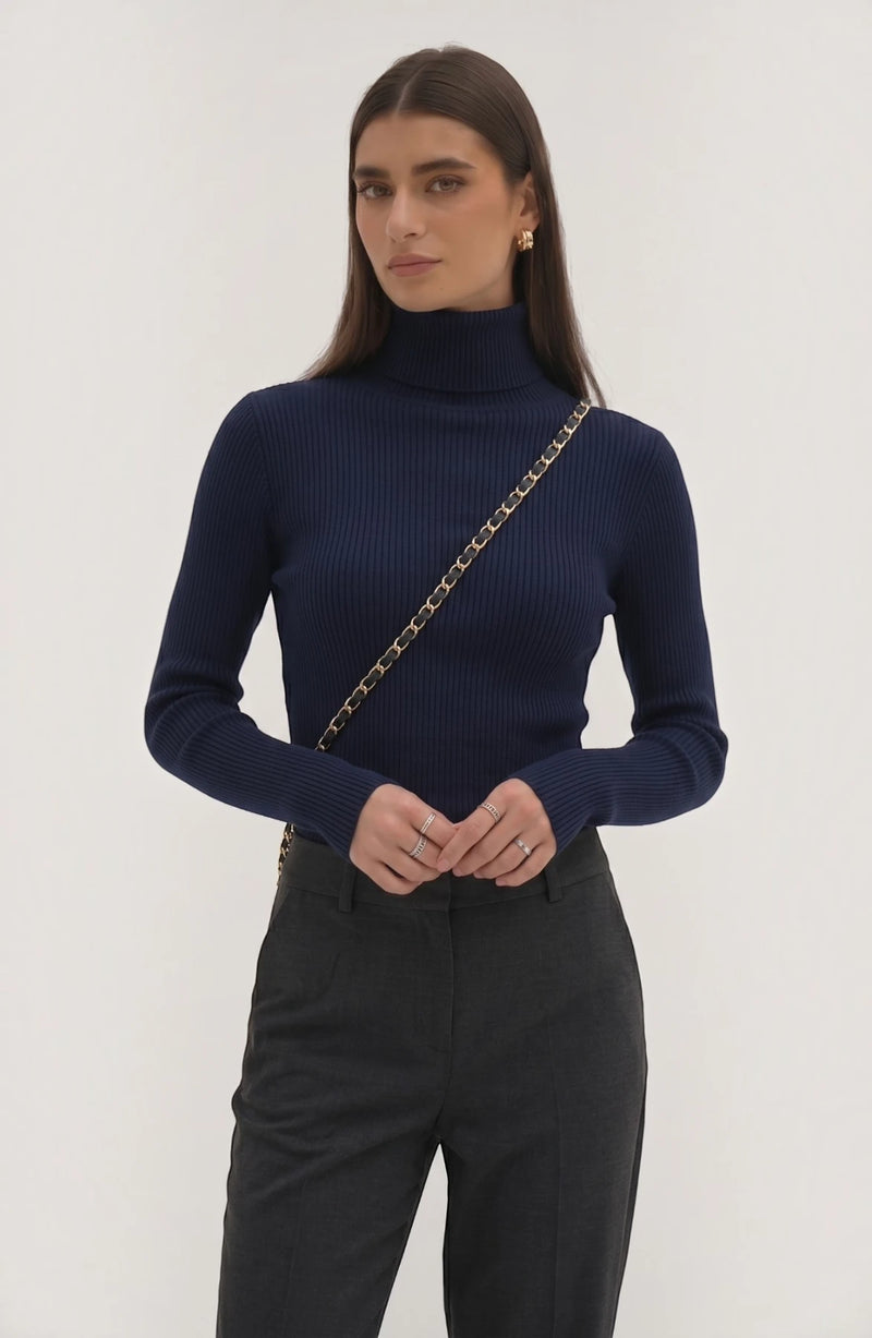 LORVENE pure soft polyester high neck top in neutral color, close-up view of fabric and high neckline detail.