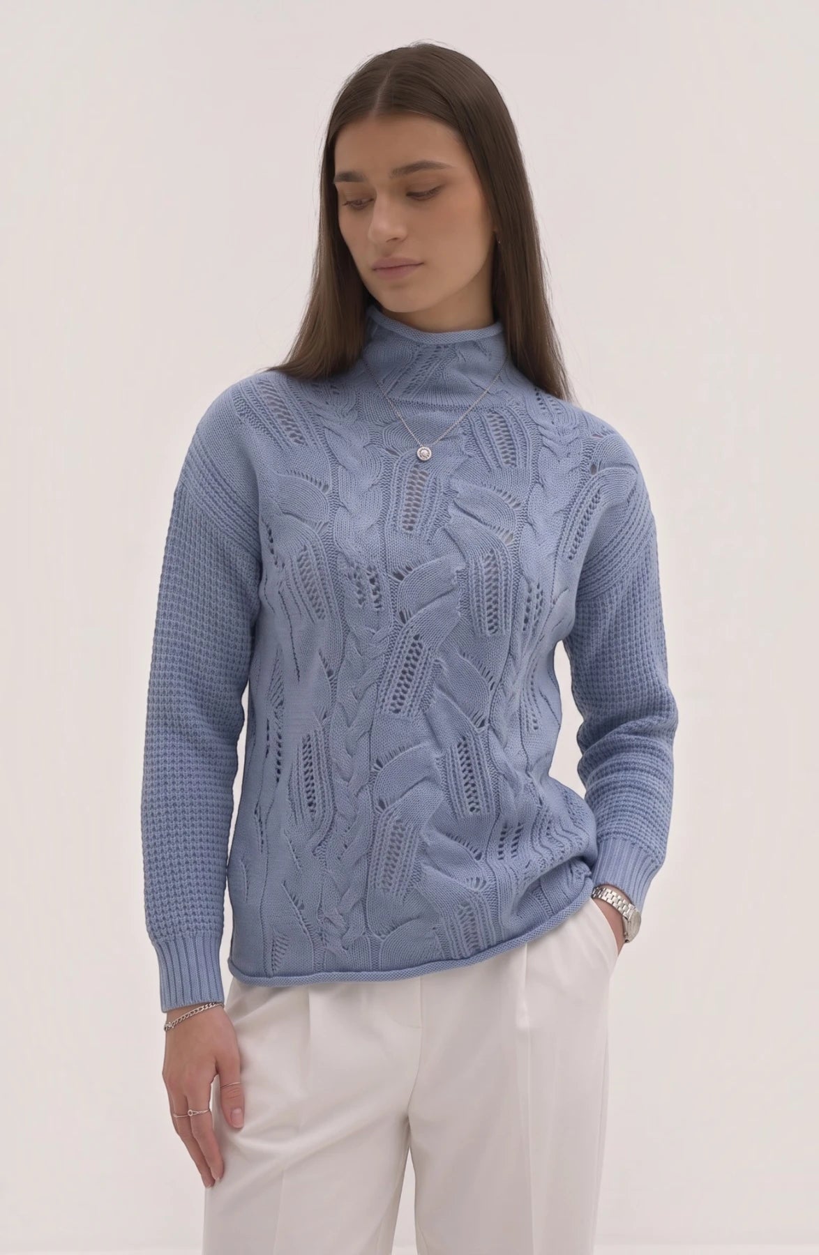 LORVENE lightweight high neck top in soft fabric, featuring a fitted design and high collar, displayed on a hanger.