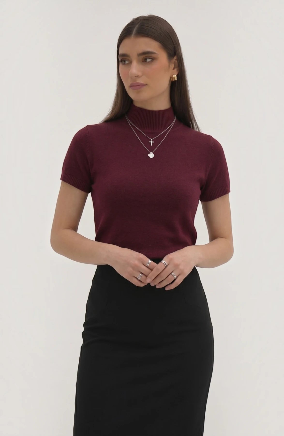 LORVENE pure poly blend high neck sweater in neutral color, featuring a close-up view of the fabric and high neckline.