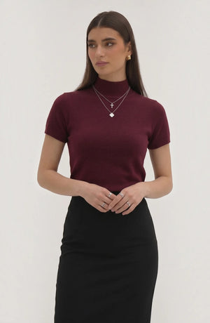 LORVENE pure poly blend high neck sweater in neutral color, featuring a close-up view of the fabric and high neckline.