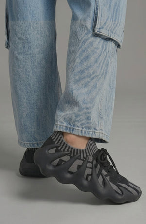 LORVENES Midnight Muse sneakers in black with white soles, featuring stylish laces and modern athletic design.